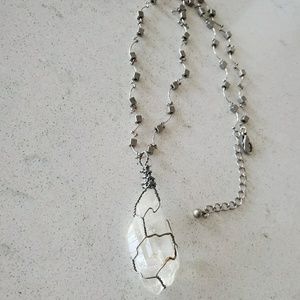 Clear crystal wrapped necklace.